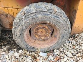 Case 1835C Left/Driver Tire and Rim - Used