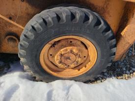 Case 1830 Left/Driver Tire and Rim - Used