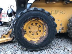 John Deere 320D Left/Driver Tire and Rim - Used