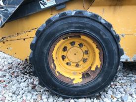 John Deere 320D Right/Passenger Tire and Rim - Used