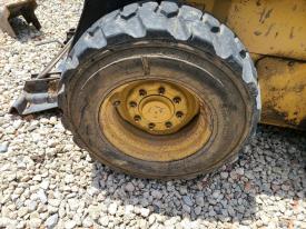 New Holland LX885 Left/Driver Tire and Rim - Used