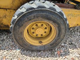 New Holland LX885 Left/Driver Tire and Rim - Used