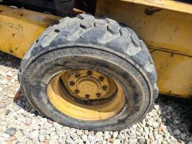 New Holland LX885 Right/Passenger Tire and Rim - Used