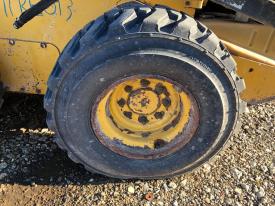 John Deere 320D Left/Driver Tire and Rim - Used | P/N KV11921
