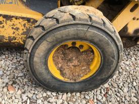 Gehl SL7810 Left/Driver Tire and Rim - Used | P/N 128508