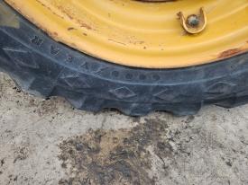 CAT TH62 Left/Driver Tire and Rim - Used
