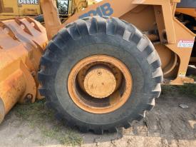 Case 721B Left/Driver Tire and Rim - Used