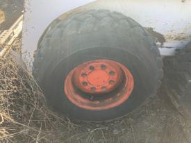 Bobcat 843 Left/Driver Tire and Rim - Used