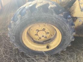 New Holland L553 Left/Driver Tire and Rim - Used