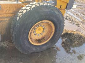 Volvo G746B Left/Driver Tire and Rim - Used