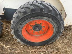 Bobcat 751 Left/Driver Tire and Rim - Used