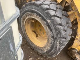 CAT 262D3 Right/Passenger Tire and Rim - Used